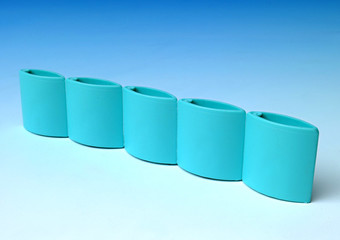 Multi-cavity molds for single-dose strip caps.